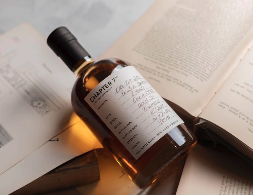 Close up of a person learning how to read a whisky label