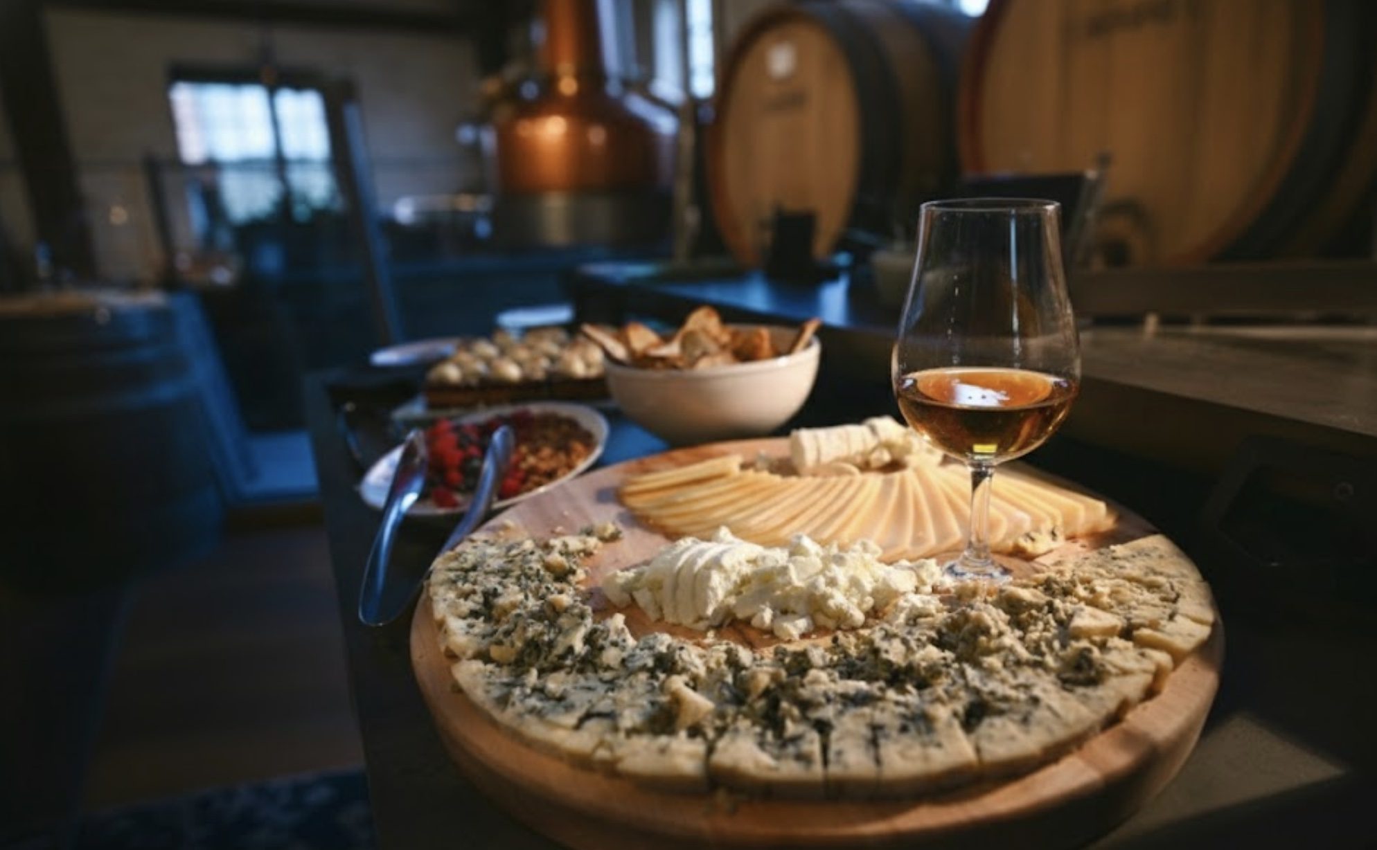 Whisky and cheese pairing board with glass