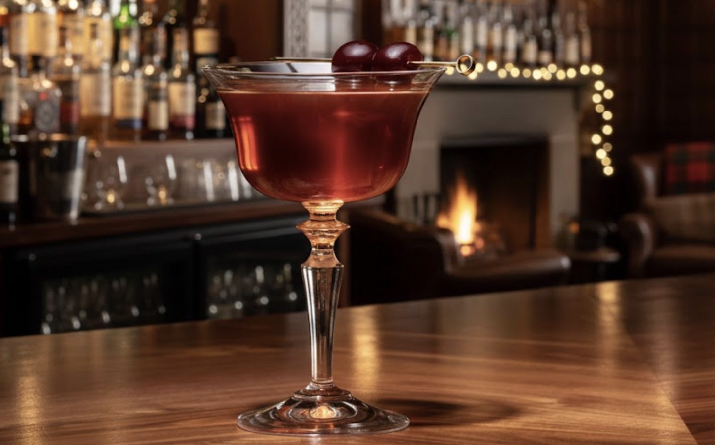 Rob Roy whisky cocktail served in a coupe glass with cherry garnish