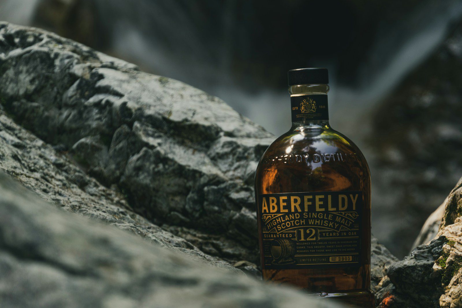 A glass of Aberfeldy Single Malt Scotch Whisky next to the bottle