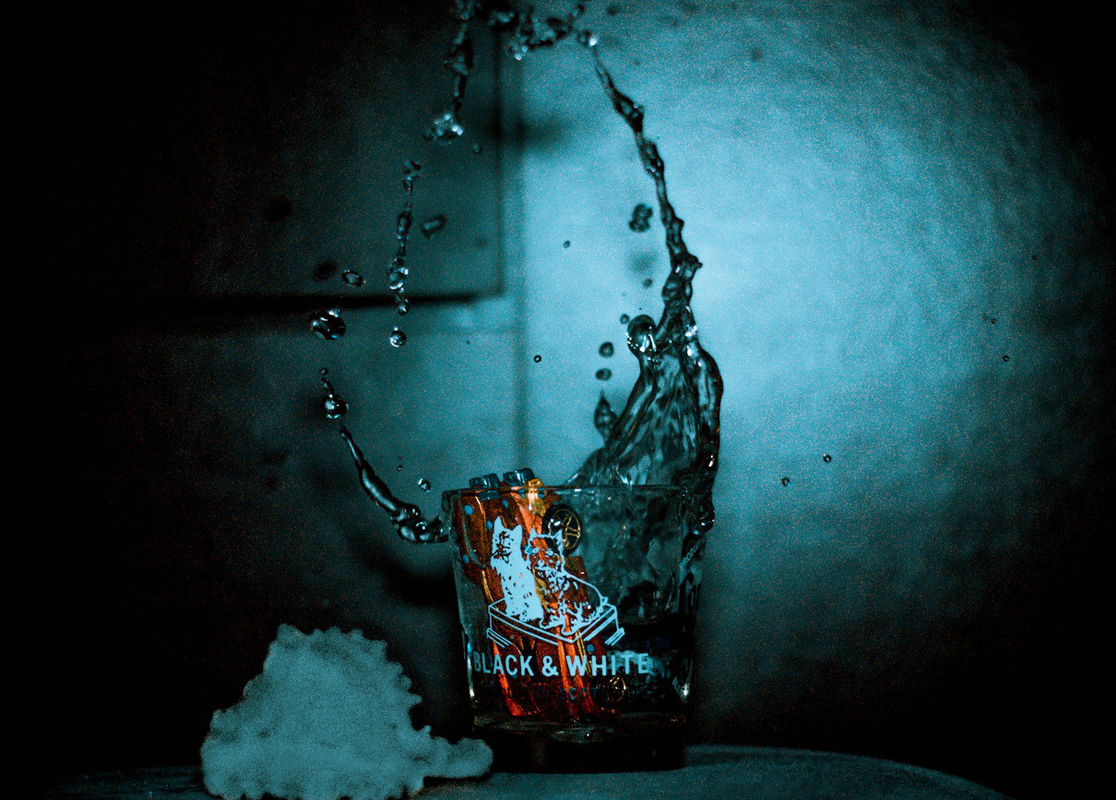 Adding drops of water to whisky to release flavor